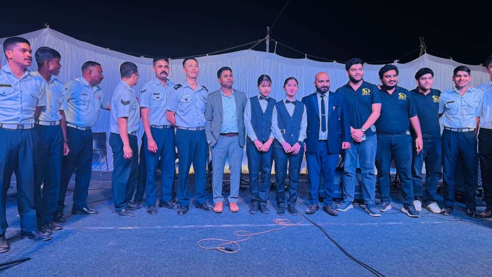 TMOI and BHLI teams at a defence community event